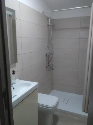 a bathroom with a toilet and a sink and a shower at Maison L'Oranger avec piscine - Domaine E Case di Cuttoli in Cuttoli-Corticchiato