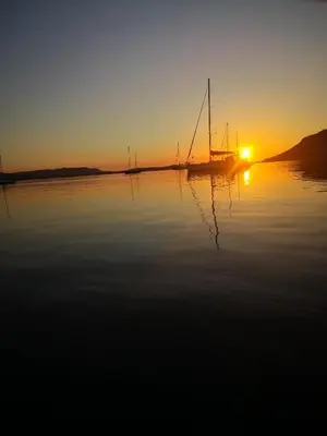a sail boat on the water at sunset at seuls à bord dans le golfe hebergement atypique in Porto-Vecchio