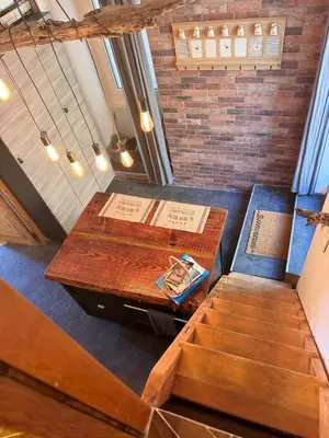 an overhead view of a table and stairs in a room at Location atypique village olmeto in Olmeto