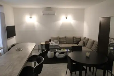 a living room with a couch and a table at Appartement Sampiero in Corte