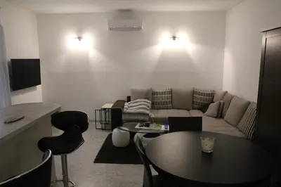 a living room with a couch and a table at Appartement Sampiero in Corte