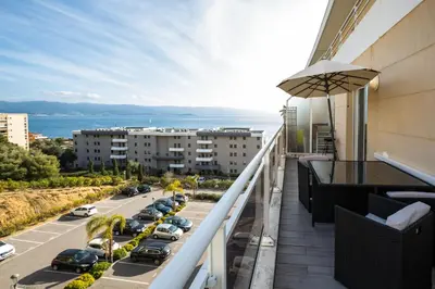 a balcony with a view of a street at Evasion Marine - T2 Vue mer - Terrasse - Plage à pied in Ajaccio