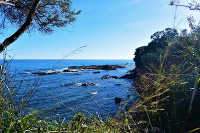 a view of the ocean with rocks in the water at TADO in Kamiesch