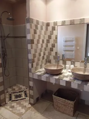 a bathroom with two sinks and a shower at Casa Myrta 3 étoiles in Porto-Vecchio