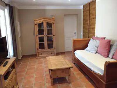 a living room with a couch and a coffee table at Casa Myrta 3 étoiles in Porto-Vecchio