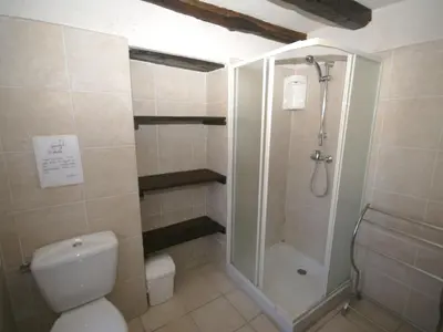 a bathroom with a shower and a toilet at Holiday Home Moriani-Plage with Pool in San-Nicolao