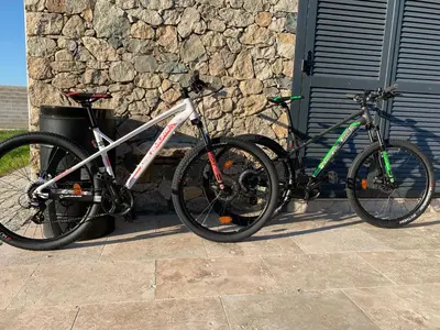 two bikes are parked next to a building at Maison Corse in Aléria