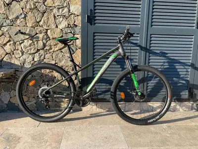 a bike parked in front of a building at Maison Corse in Aléria