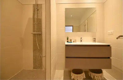 a bathroom with a sink and a shower at SARL valinco locations in Olmeto