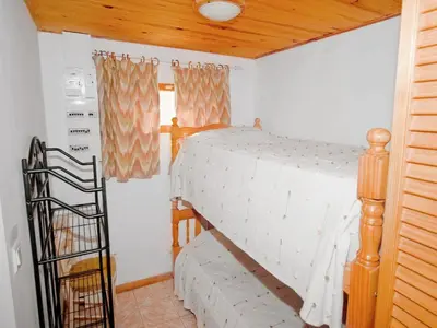 a bedroom with a bunk bed in a room at Riverside Home in Folelli in Penta-di-Casinca