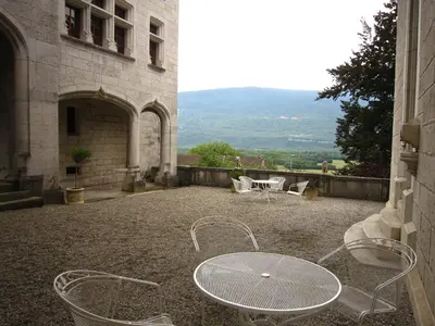 a patio with a table and chairs in a building at Delightful Villa at Moriani-Plage with Garden in San-Nicolao