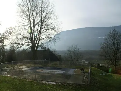 a bird bath on a hill with a tree at Delightful Villa at Moriani-Plage with Garden in San-Nicolao