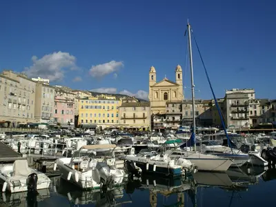 a group of boats docked in a harbor with buildings at Villa in Moriani-Plage by the Sea in San-Nicolao
