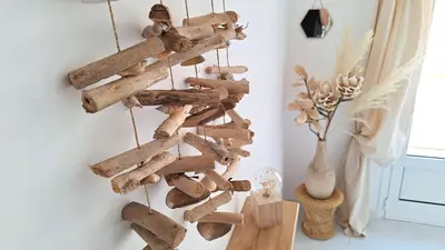 a bunch of drift wood hanging on a wall at Casa Mina in Pietrosella