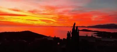 a sunset over a body of water with the sky at Casa Mina in Pietrosella