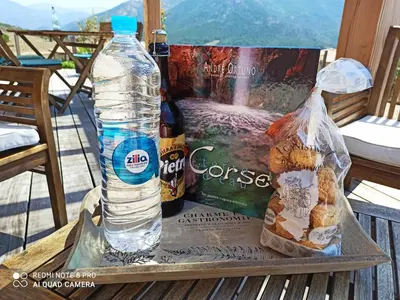 two bottles of water and bread on a table at Sagone in Vico