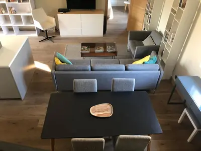 a living room with a couch and a table at Appartement Centre ville in Porto-Vecchio
