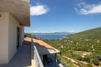 a balcony of a house with a view of the ocean at Villa neuve architecte vue mer in Belvédère