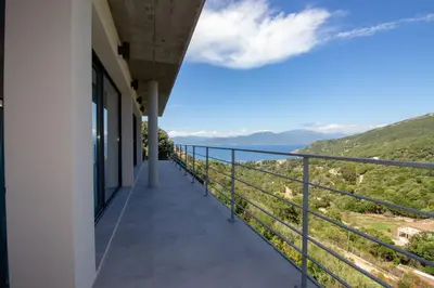 a balcony with a view of the mountains at Villa neuve architecte vue mer in Belvédère