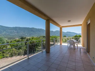 a balcony with a view of the mountains at Spacious Villa with Pool in Santʼ Andrea-dʼOrcino
