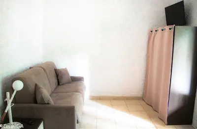 a living room with a couch and a tv at Résidence de Filitosa - Le Torréen in Sollacaro