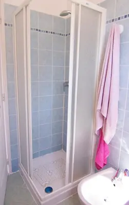 a bathroom with a shower and a sink at MORA in Conca