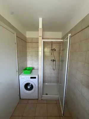 a bathroom with a washing machine and a washer at BIJOU in Conca