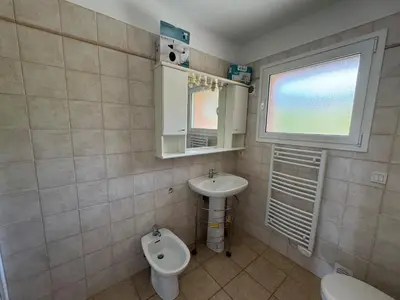 a bathroom with a toilet and a sink at BIJOU in Conca