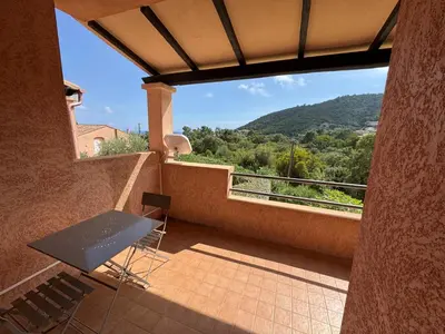 a balcony with a table and chairs and a view at BIJOU in Conca