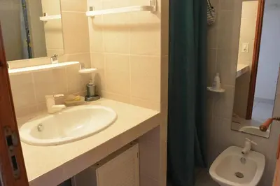 a bathroom with a sink and a toilet at ORO 53 in Conca