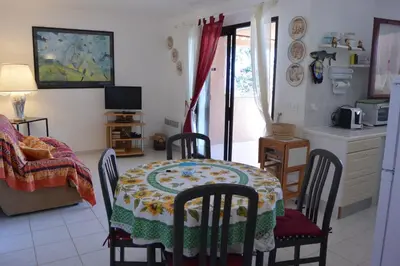 a kitchen with a table and chairs and a kitchen with a table and a table at ORO 53 in Conca