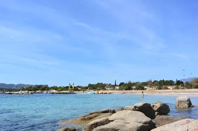 a view of a beach with rocks in the water at St CYPRIEN C20 in San Ciprianu