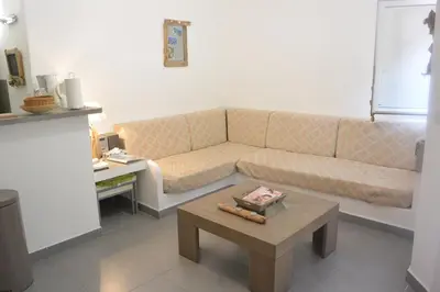 a living room with a couch and a coffee table at St CYPRIEN C20 in San Ciprianu