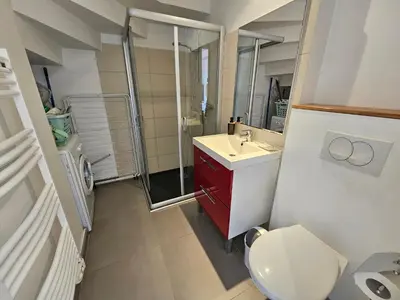 a bathroom with a toilet and a sink and a shower at SERENA-Piscine privée- Vue Mer in Conca