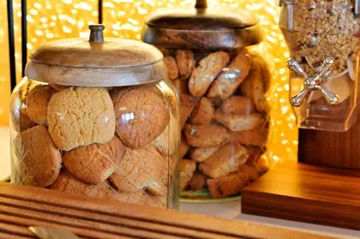 two glass jars filled with breads on a table at Hotel Des Roches in Sartène