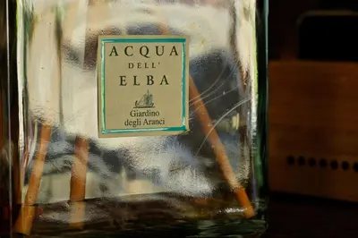 a bottle of alcohol with a label on it at Hotel Des Roches in Sartène