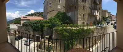 a view from a balcony of a building at Hotel Des Roches in Sartène