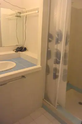 a bathroom with a shower and a sink at St CYPRIEN D23 in Porto-Vecchio