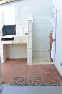 a bathroom with a sink and a shower at St CYPRIEN D23 in Porto-Vecchio