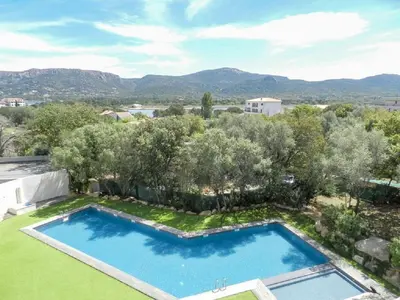 an overhead view of a swimming pool in a yard with trees at Studio standing Piscine vue mer in Porto-Vecchio