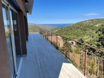 a balcony with a view of the ocean at Maison & Piscine Privée Vue Mer panoramique très calme indépendant in Porto-Vecchio
