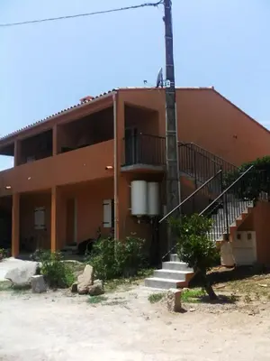 a building with a staircase in front of it at Casapiana 08 in Porto-Vecchio