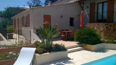 a house with a patio and a swimming pool at Villa Jeromine in Porto-Vecchio