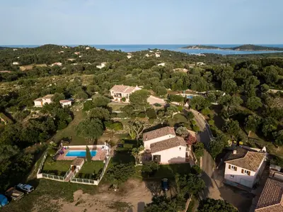 an aerial view of a house with a swimming pool at residence Catalani in Zonza