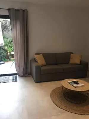 a living room with a couch and a coffee table at Villa Filippi in Porto-Vecchio