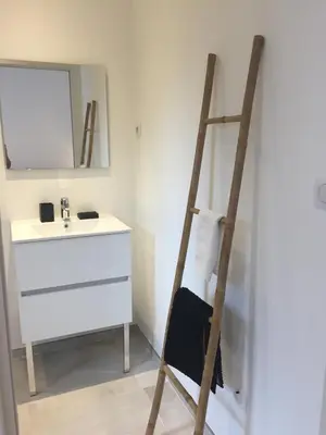 a ladder in a bathroom with a sink and a mirror at Villa Filippi in Porto-Vecchio
