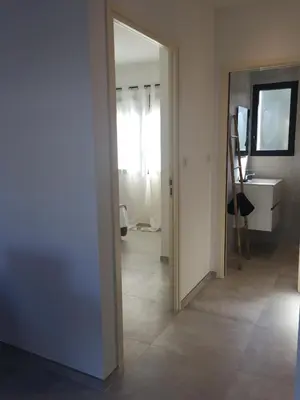 a hallway with a door leading to a room at Villa Filippi in Porto-Vecchio