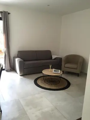 a living room with a couch and a coffee table at Villa Filippi in Porto-Vecchio