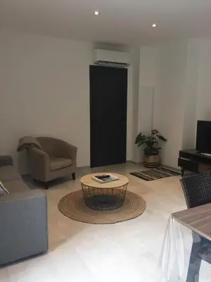 a living room with a couch and a coffee table at Villa Filippi in Porto-Vecchio