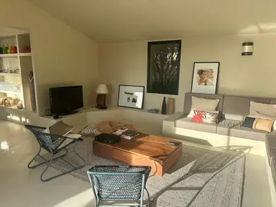 a living room with a couch and a coffee table at Villa Valrossa in Porto-Vecchio